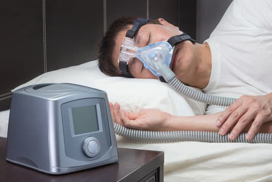Man pointing to CPAP screen